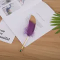Creative purple and gold feather gel pen stationery item perfect for Christmas gifts. - Purple