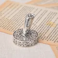 Detailed view of antique silver carved round metal pen holder base for quill pens - White Gold