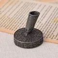 Close-up of vintage engraved metal pen base with floral pattern - Antique Pewter