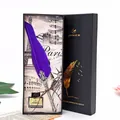 Close-up of luxury purple feather dipping pen gift set in a classic black box. - 1 Pen + 1 Ink + 5 Nibs / Blue