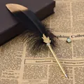 Macro detail of a vintage black feather ballpoint pen with gold leaf ornament on newspaper - 黑色(8064) / 0.5mm