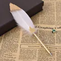 Detailed view of a vintage white feather ballpoint pen with gold metallic finish - 粉白(8064) / 0.5mm