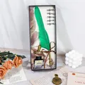 Detailed view of vintage green feather dip pen gift set with ink and nibs - Feather Pen Gift Set (004) / Dark Green