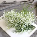Detailed view of white artificial baby's breath bouquet for elegant home decoration. - White