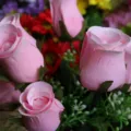 Close-up detail of artificial pink rose buds for wedding home decor. - Pink