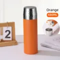 Portable orange 480ml vacuum insulated flask featuring a hammered silver lid cup - 16oz / Orange