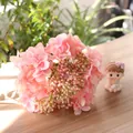 Detail shot of delicate pink artificial silk hydrangea flowers for home decoration - Pink