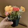 Small artificial daisy and peony potted plant featuring vibrant orange and pink silk flowers - Wild Daisy / Orange Daisy