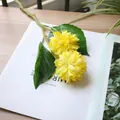 Detailed close-up of yellow artificial ball chrysanthemums for home decor photography. - Yellow