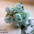 Detailed close-up of a 7-head light blue artificial silk rose bouquet for wedding decor - Lake Blue Rose