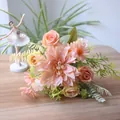 Close-up of pink artificial dahlia and rose bouquet on a wooden table for home decor - Champagne