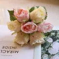 Detailed close-up of artificial rose bouquet with pink and cream petals for wedding - Pink Yellow Rose
