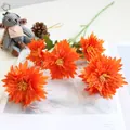 Detailed macro view of vibrant orange five-head artificial chrysanthemums for home decor. - Orange