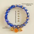 Elegantes blaues Glasperlenarmband mit Goldfolie und traditionellen Glücksbringern - Mythische Bestie Glücksbringer / 10mm Perlendurchmesser / Dunkelblau