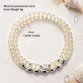 Bracelet double rang en cristal citrine avec perles de riz argentées sur fond de sable. - Bracelet Double Boucle Citrine Citron / Diamètre des perles 4MM