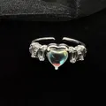 Close-up of silver heart moonstone ring with sparkling zircon accents on black background. - Adjustable Open Size / Style 1 (ALk5JxmTKa5)