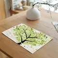 Detailed view of the artistic green tree and ladybug pattern on a white linen placemat - 绿色圆点大树款式(7823-5) / 32*45cm