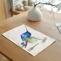 Detail view of a linen cotton placemat with a colorful watercolor hummingbird print. - 32x45cm / Feather Hummingbird (7003-6)