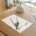 Linen placemat with watercolor hummingbird pattern on a wooden table with a fork - 32x45cm / Watercolor Hummingbird (7003-4)