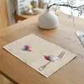 Detailed macro of a linen placemat with watercolor hummingbird prints on a wooden table. - 32x45cm / Double Hummingbirds (7003-17)