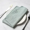 Light green cotton cloth napkin folded on a white plate - 32x32cm / Light Green