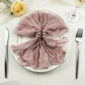 Mauve gauze cloth napkin shaped in elegant bow on plate - 44x44cm / Lotus root pink