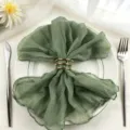 Elegant sage green cheesecloth napkin with golden metal ring for rustic wedding table decoration - 44x44cm / Light Green