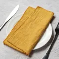 Handcrafted yellow slub cotton cloth napkin with overlock edge for elegant table setting - 32x32cm / Bright yellow