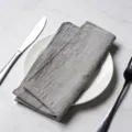 Premium grey hemmed cotton napkin for elegant dining table setting on white marble texture - 32x32cm / Gray