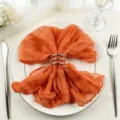 Elegant orange cheesecloth napkin for wedding table decor featuring a silver triple ring - 44x44cm (1 Piece) / Orange