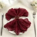 Burgundy cheesecloth napkin with gold ring on white plate for wedding table decor - 44x44cm (1 Piece) / Jujube Red