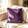 Luxury purple Holland velvet square pillowcase with pom-pom trim on a cozy cream sofa - 45x45cm / Purple