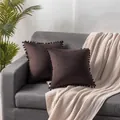 Dark brown Dutch velvet cushion covers with pom-pom trim displayed on grey sofa - 45x45cm / Chocolate