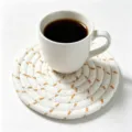 Round white woven cotton rope coaster with orange accents holding a coffee cup - 11cm Diameter (1 Piece) / White with Light Brown Stitching Spiral Style (29)