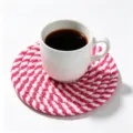 Hand-woven cotton rope coaster in a vibrant pink and white spiral braided design - Diameter 11cm / Pink and White