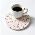 Hand-woven white cotton rope coaster with pink accents and a white ceramic coffee cup. - Diameter 11cm (One Piece) / Off-White with Rose Red Stitching (43)