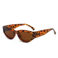 Retro cat-eye sunglasses featuring a bold tortoise shell pattern with brown lenses. - Tortoise Frame Tea Lens