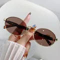 Retro chic oval metal sunglasses featuring elegant brown lenses for women's street style - Gold Frame Gray Brown Lens