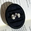 Detail of a French baroque open ring with pearls and star-shaped crystals on black velvet - Pearl & Star Decoration (No. 4) / Adjustable Open