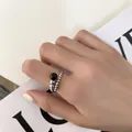 Close-up detail of a minimalist silver beaded ring with a black gemstone accent - Adjustable Open / Beaded Black Gemstone Style (J1231)