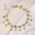 Detail view of gold double-layer necklace with blue crystals and mini shell pendants - Double Layer Shell Blue Rhinestone Bracelet / Blue