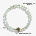 Natuurlijke lichtgroene prehniet kralenarmband met een groen rutielkwarts middelpunt - Prehniet Armband / 6mm Kralen (15cm Omtrek)