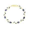 Dettaglio del bracciale vintage foglia di tulipano con zirconi blu. - Oro + Blu