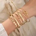 Elegante set di sei bracciali rigidi dorati regolabili con motivi floreali e di cuori - Set Fiore Tipo G