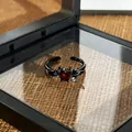 Detailed view of gothic black demon wings adjustable ring with a red heart stone - Style 1 Adjustable Ring