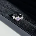 Close-up of elegant purple crystal ring with sparkling butterfly wing design - No. 1 Open Ring (Swan Wing)
