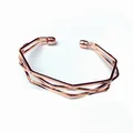 Detailed view of a minimalist rose gold irregular geometric layered cuff bracelet. - Five-Layer Irregular Geometric Style / Rose Gold