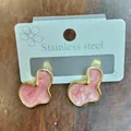 Detailed view of pink cloud-shaped drop earrings with a gold stainless steel frame - Geometric Cloud Style / Pink