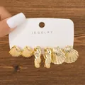 Detailed view of 3-pair gold fashion earring set featuring shell and twisted C-shapes - Shell Twisted Texture Set (TZ019) / 3 Pairs Set / Gold