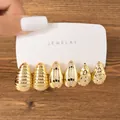 Detail of gold teardrop earring set with ribbed, smooth, and hammered textures. - Slotted Hammered Water Drop Set (TZ011) / 3 Pairs Set